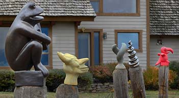 Sculptures In Front Of House